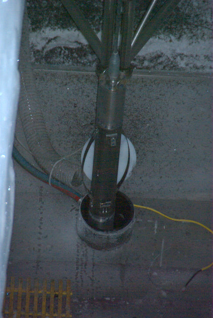 bore hole with drill being lowered